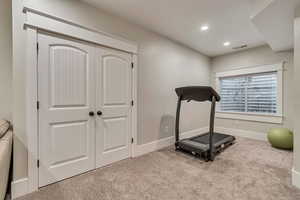 Workout room featuring carpet, recessed lighting, and baseboards