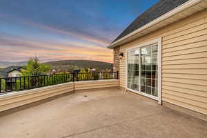 View of patio / terrace with a balcony and a mountain view