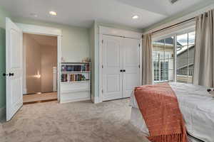 Carpeted bedroom with recessed lighting, a closet, and baseboards