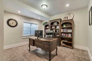 Office featuring light carpet, baseboards, and recessed lighting