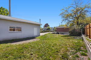 View of yard featuring fence