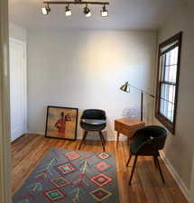 Sitting room featuring wood finished floors