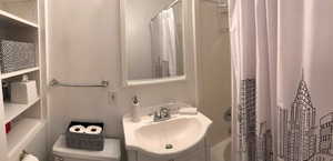 Full bath featuring a sink