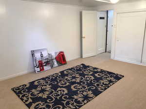 Playroom featuring carpet floors and baseboards