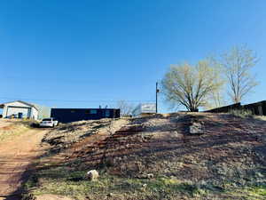 View of yard featuring fence