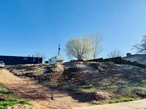 Entry to storm shelter with fence