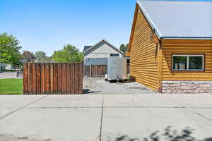 Side of the property featuring additional RV parking and room for home expansion, if desired
