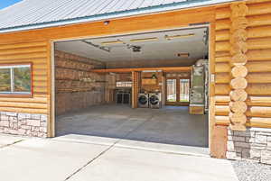 HUGE, 810 square foot oversized garage with room for all your toys, French doors, second set of washer/dryer hook-up (there are also hook-ups for a stackable washer and dryer in a separate closet in the primary bedroom), and a 9' tall garage door!