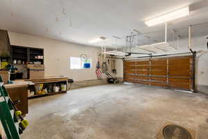 Garage featuring a garage door opener