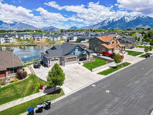 Aerial view of residential area featuring a water and mountain view