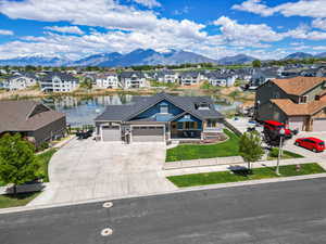 Aerial perspective of suburban area featuring a water and mountain view