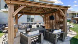 View of patio featuring a gazebo and an outdoor hangout area