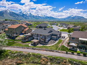 Aerial perspective of suburban area featuring a mountainous background