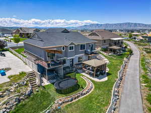 Aerial perspective of suburban area featuring a mountainous background