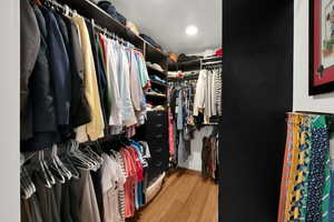 Spacious closet featuring wood finished floors
