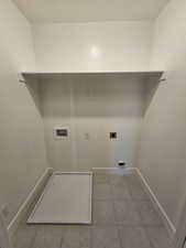 Washroom with washer hookup, electric dryer hookup, and baseboards