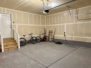 Garage featuring a garage door opener
