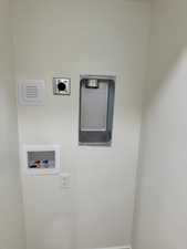 Clothes washing area with electric dryer hookup and hookup for a washing machine