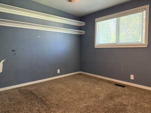 Spare room with carpet floors and baseboards