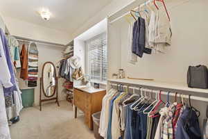 Spacious primary walk-in closet.