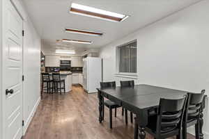 Dining area with light wood finished floors