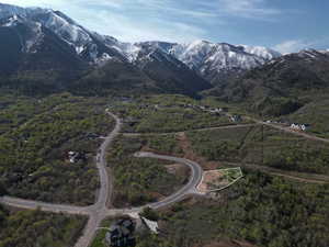 Aerial overview of property's location featuring a mountainous background