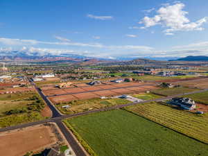 View of rural area with a mountain backdrop and farmland