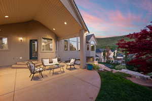 View of patio with outdoor lounge area and fence