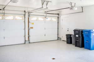 Garage featuring a garage door opener