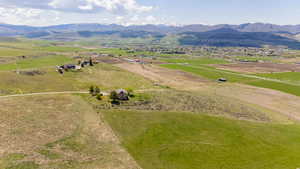 Aerial view of sparsely populated area featuring a mountainous background