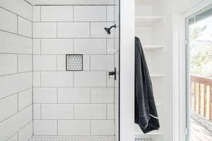 Full bath with a tile shower