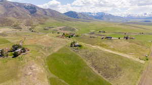 Aerial view of property's location featuring rural landscape and mountains