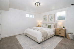 Carpeted bedroom with baseboards
