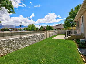 View of yard featuring a patio and a mountain view