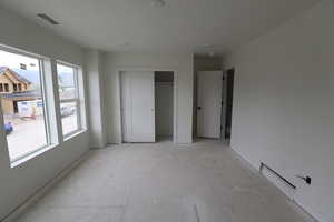 Unfurnished bedroom with baseboards and a closet