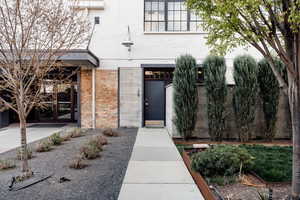 Entrance to property with french doors and brick siding
