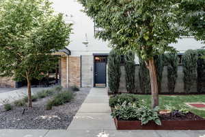 View of front of home featuring brick siding