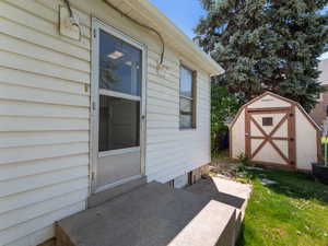 Doorway to property with a yard