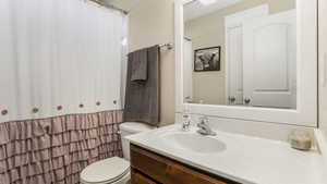Bathroom with toilet and vanity