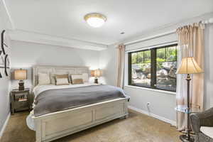 Carpeted bedroom with baseboards