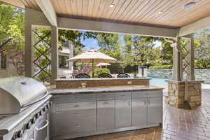 View of patio featuring a grill, an outdoor pool, area for grilling, and mail area