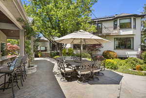View of patio / terrace featuring a balcony and outdoor dining area