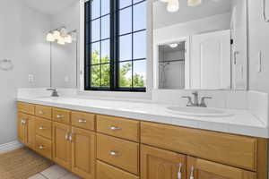Bathroom featuring double vanity and tile patterned floors