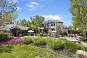View of yard featuring a patio area, an outdoor living space, and a balcony