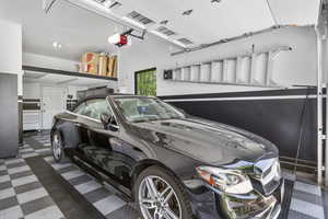 Garage featuring a garage door opener