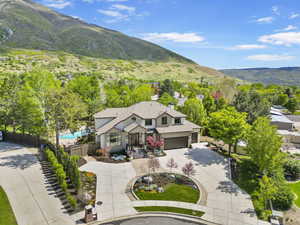View from above of property featuring mountains and a pool