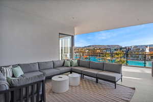 View of patio featuring an outdoor hangout area and a community pool