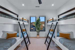Carpeted bedroom with recessed lighting, baseboards, and a ceiling fan