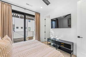 Carpeted bedroom with access to exterior, baseboards, ceiling fan, and recessed lighting