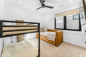 Bedroom with light carpet, recessed lighting, ceiling fan, and baseboards